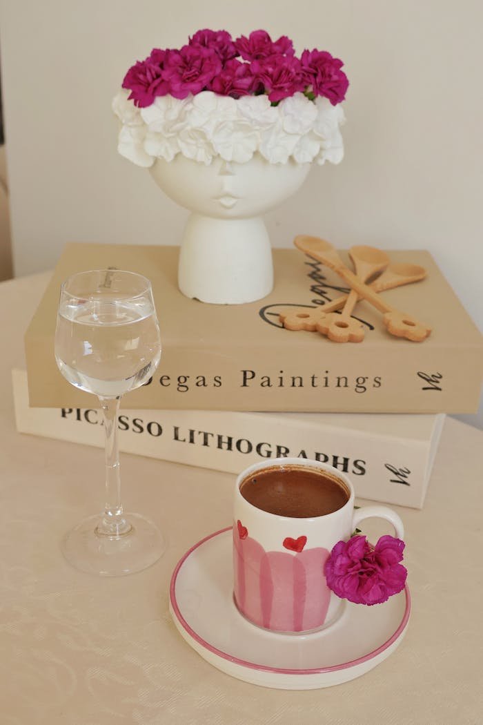 our-services-02 Charming floral arrangement with coffee and decor on a stylish table setting.